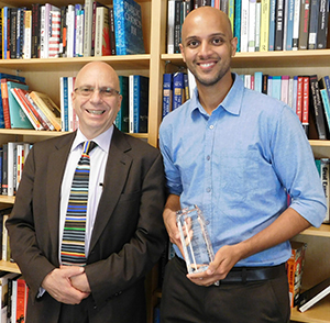 Ian Shapiro presented Tariq Thachil, right, with the Gaddis Smith International Book Prize for best first book.